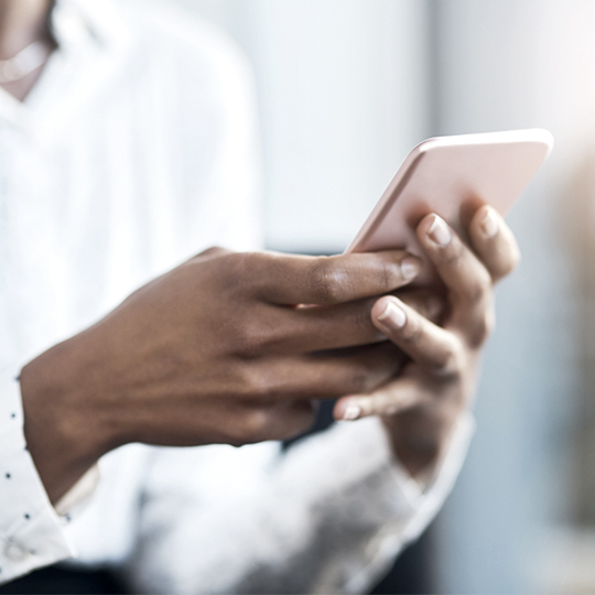 Hands holding smartphone