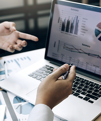 man typing on a laptop