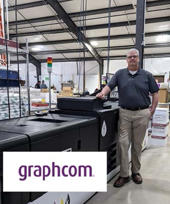 Direct mail printer stands next to Kyocera commercial printer.