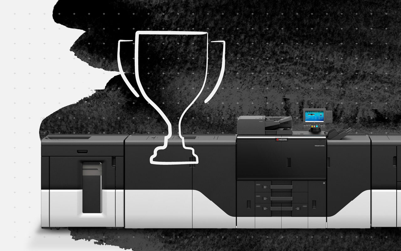 Kyocera printer, with trophy icon, representing award-winning commercial printing portfolio with black ink brush stroke.