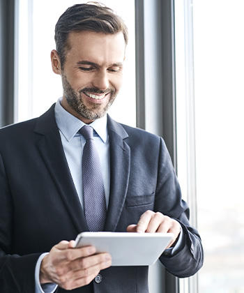 Man looking at a tablet.