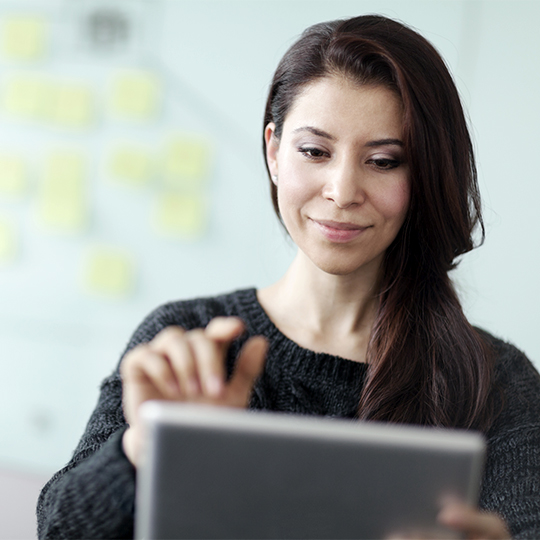 Woman looking at tablet