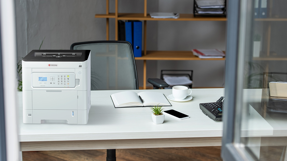 A desktop printer in an office.