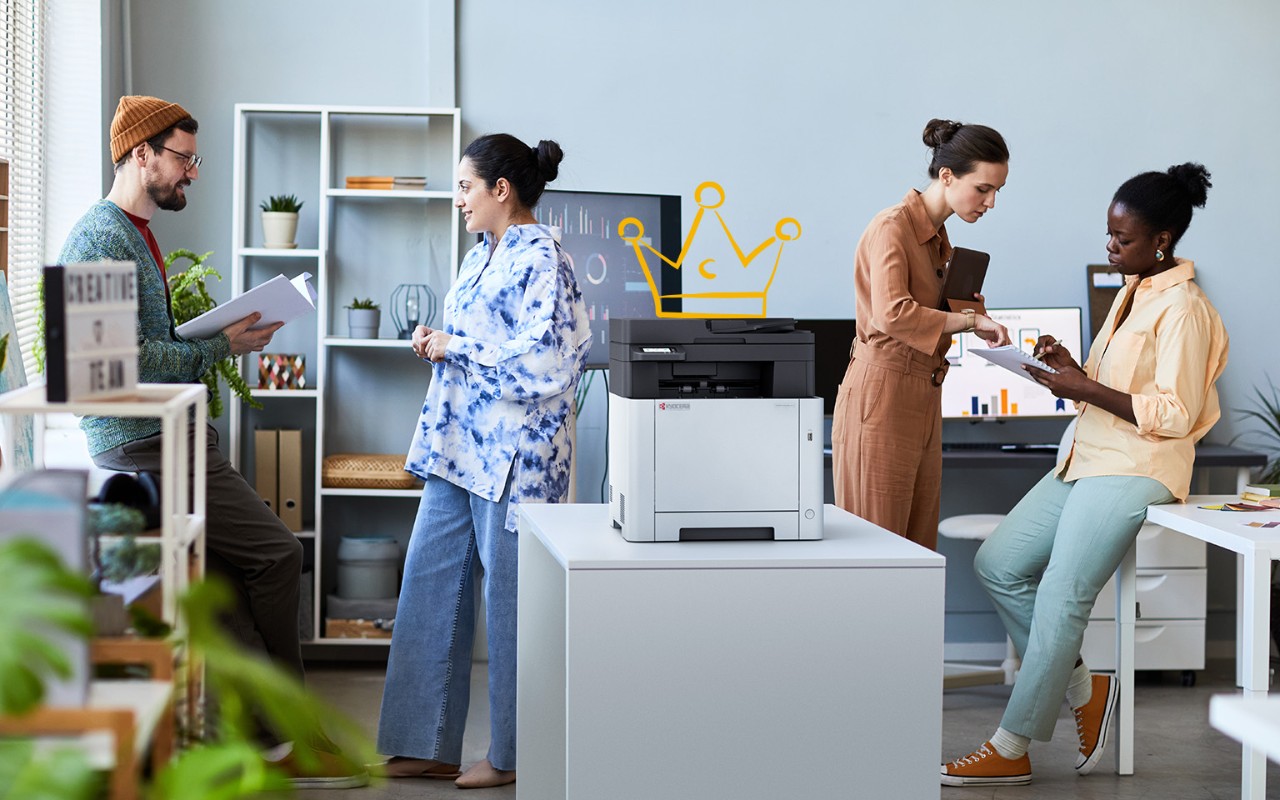 Professionals working using an office printer.