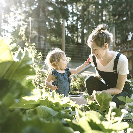 Mother and baby in a garden