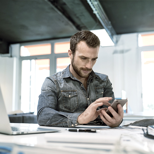 man holding his phone