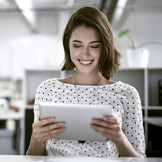Woman looking at tablet