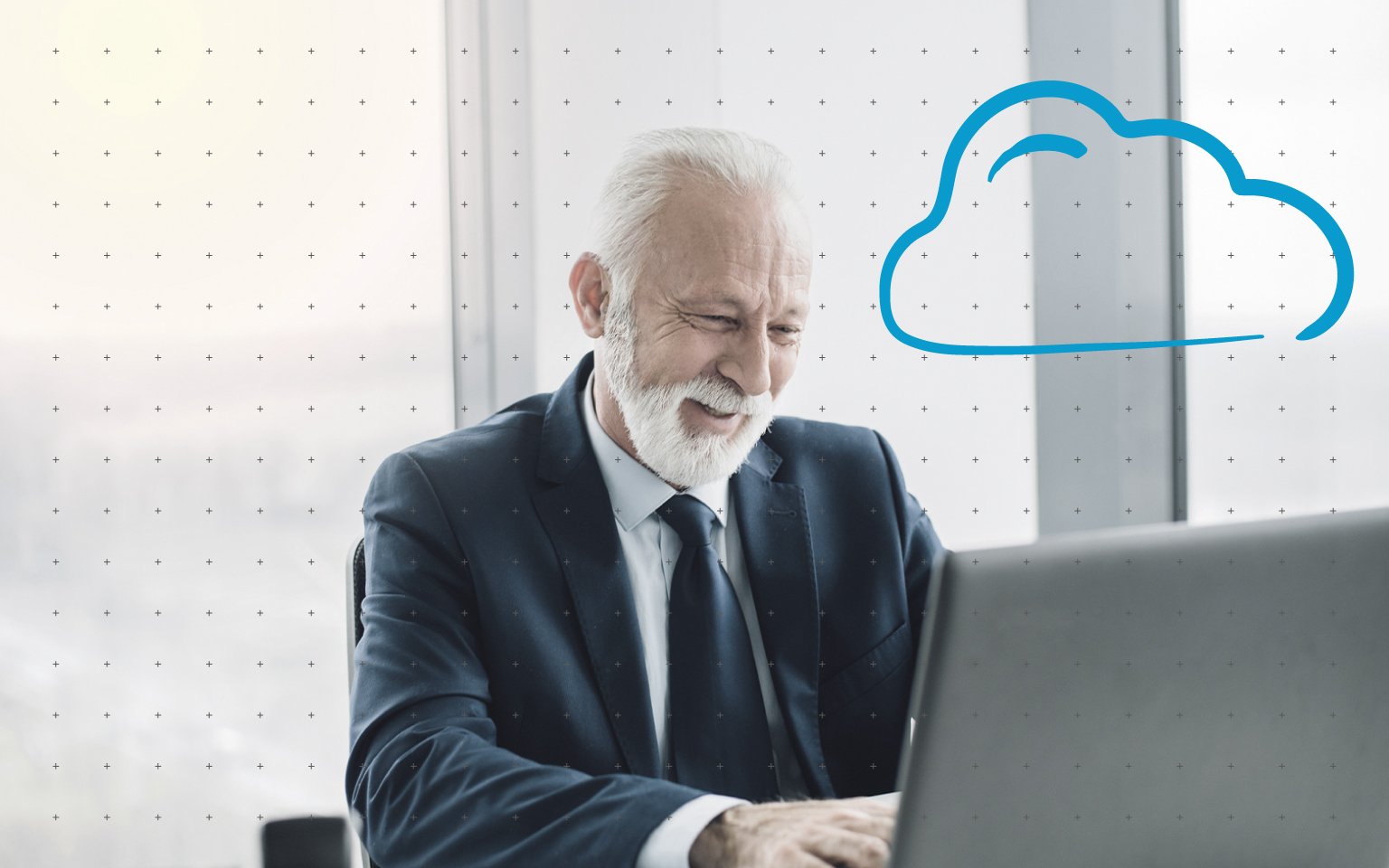 Elderly man sitting in front of a laptop