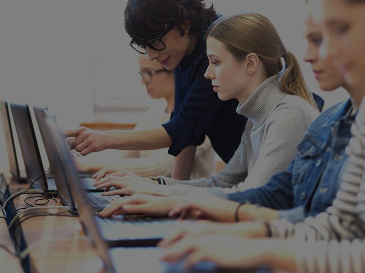 Tailored solutions for schools teacher with group of students