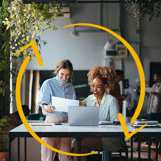 Discover the future of document solutions Two professionals using document solutions to work.