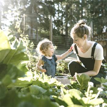Mother and baby in a garden
