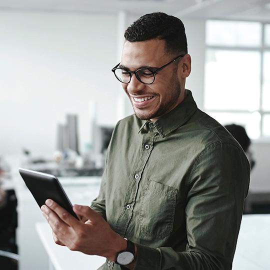 The tool to boost your business Man looking at tablet