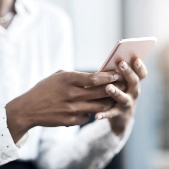 Hands holding smartphone