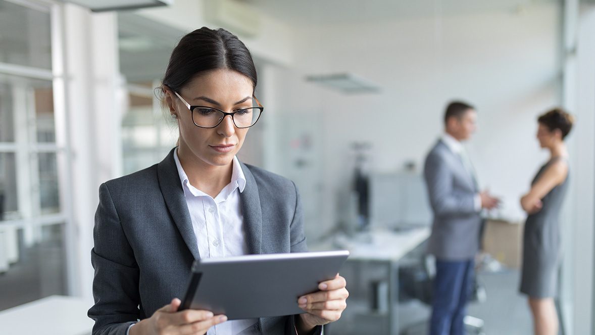 businesswoman looking at tablet businesswoman looking at tablet