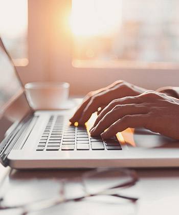 hands with laptop