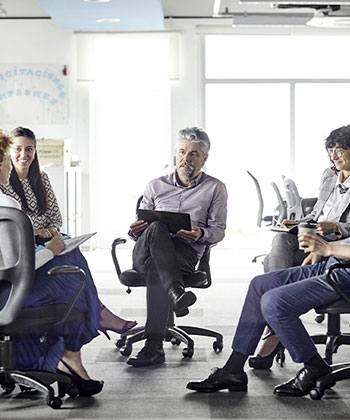 Learning and Development Man with tablet in a group setting